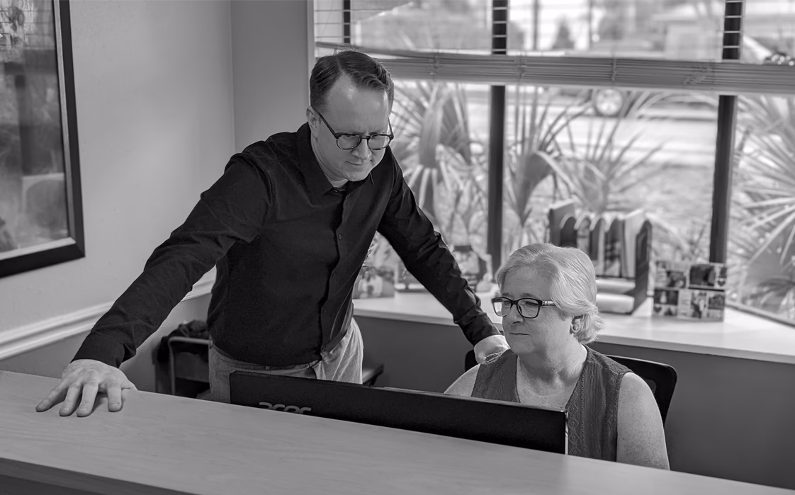 Justin Remol with a client at the firm's office in Destin, Florida